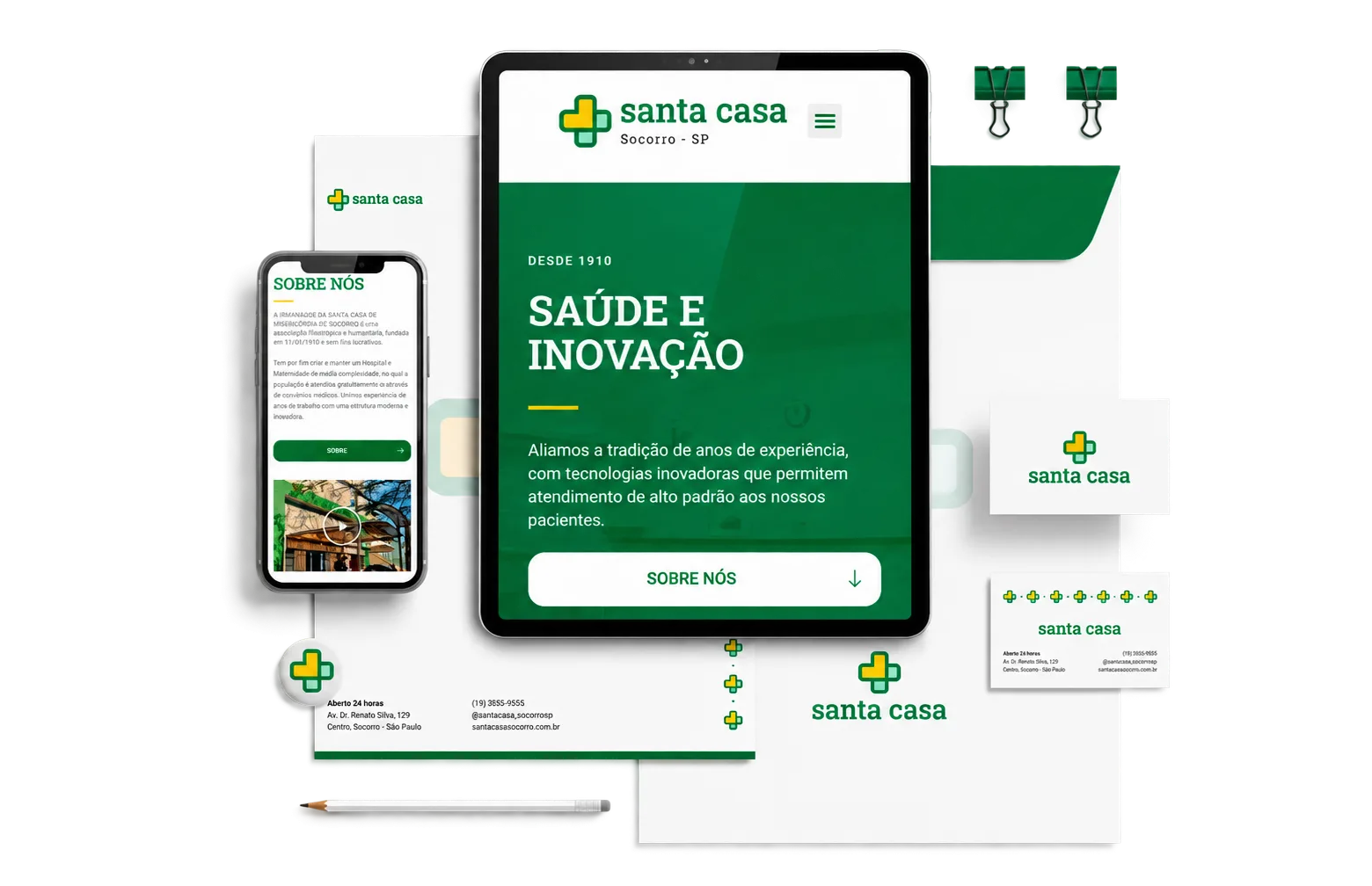 identidade visual da Santa Casa aplicada em site, celular e papelaria